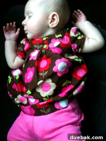 Mastering House Showings For Sale By Owner 6 A baby comfortably napping in the driver's seat of a car, a picture of serenity