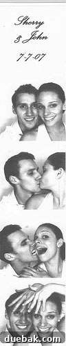 Our First Home: A Collection of Cherished Memories 8 Wedding couple posing in a photo booth