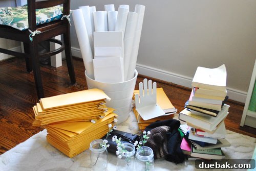 Our 100 Item Purge 2 A pile of items ready for donation or disposal from a home office, including books, old electronics, and miscellaneous office supplies.