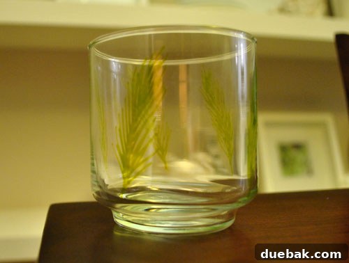 Craft Personalized Glasses with Paint Pens 4 Two completed hand-painted glass tumblers with subtle festive designs.