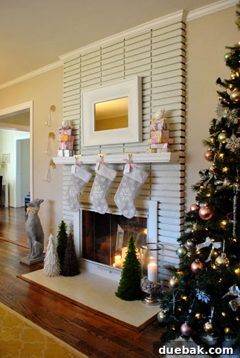 Feather trees and classic Christmas stockings hanging on a fireplace mantel, creating a warm holiday scene.