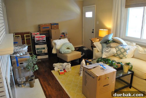 Beautifully staged living room with a cozy sofa and decor, showcasing a home ready for new owners.