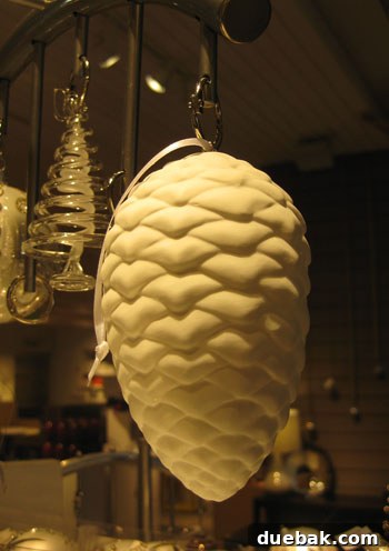 Elegant ceramic pinecone ornament, a unique gift for nature lovers and holiday decor.