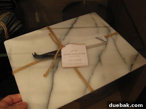 Elegant marble cheeseboard with knife for sophisticated entertaining