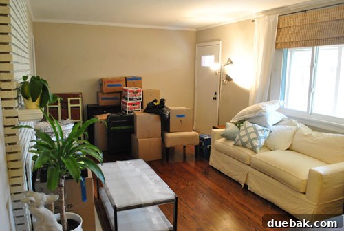 Smart Moving: Checklists and Pro Tips 3 Other Side Of Living Room Filled With Moving Materials and Furniture Padded for protection