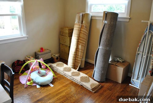 Smart Moving: Checklists and Pro Tips 6 Guest Bedroom With Furniture Packed and Rugs Rolled Up Ready For Moving Truck, optimizing space