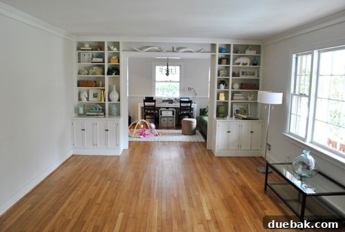 Cleaned up living room with built-in cabinets and minimal decor, ready for transformation