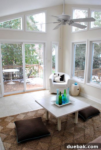 Vertical shot of the sunroom with ample natural light, showing potential for decor