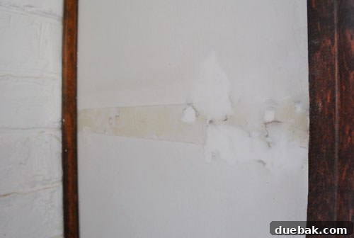 Repaired wall after applying lightweight spackle, showing a perfectly smooth finish