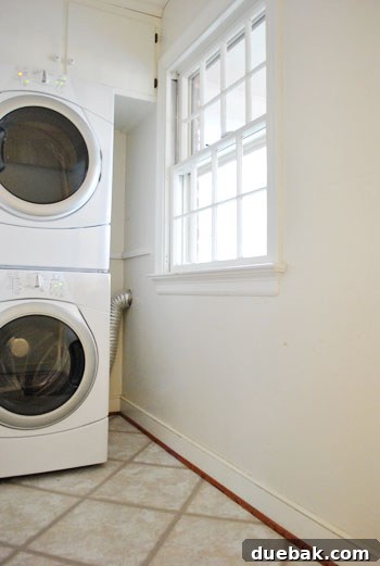 Unveiling Our Whirlpool Duets Stackable Washer and Dryer 5 Laundry room corner with newly installed Whirlpool Duet washer and dryer, space for future shelving