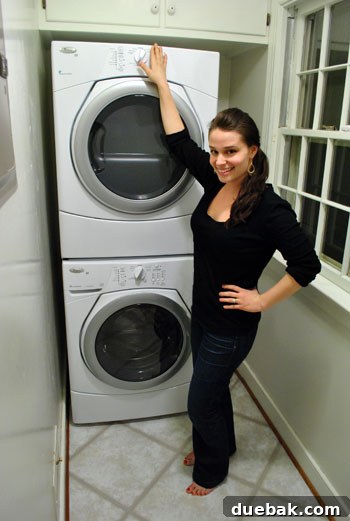 Unveiling Our Whirlpool Duets Stackable Washer and Dryer 6 Wife demonstrating ease of reaching stacked dryer controls