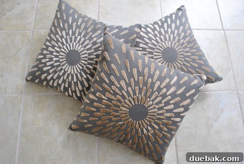 Pillow Poaching at Target 2 Close-up of a patterned gray velvet pillow with elegant texture.