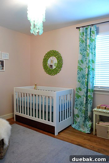 Dreamscape Nursery Art 6 Corner view of Clara's nursery, highlighting a cozy armchair and window treatment