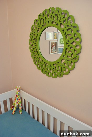 Dreamscape Nursery Art 7 Green ornate mirror securely mounted in Clara's nursery