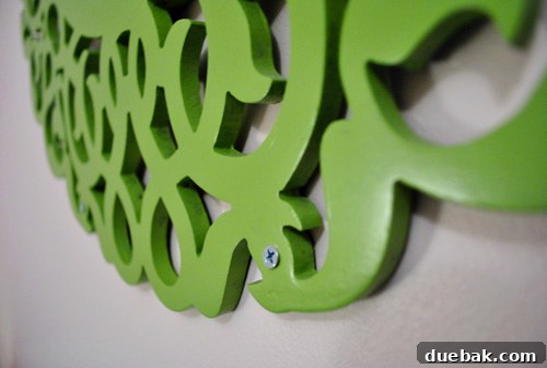 Dreamscape Nursery Art 9 Detail of the ornate green mirror frame with hidden painted screw heads