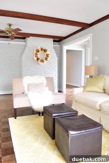 Breathing New Life Into Our Living Room Trim 6 Conceptual image of living room with newly painted white trim and dark gray ceiling beams, showing design potential