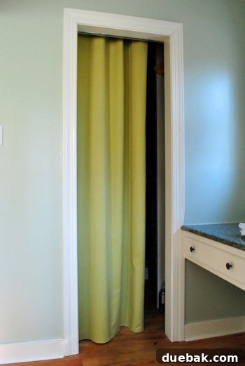 Closet interior with the yellow-green curtain pulled closed, offering privacy