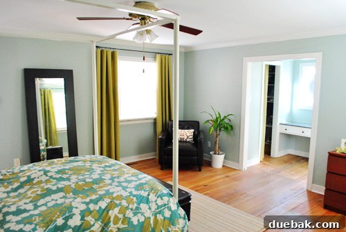 Close-up of the stylishly hung yellow-green curtains, showcasing the fabric texture
