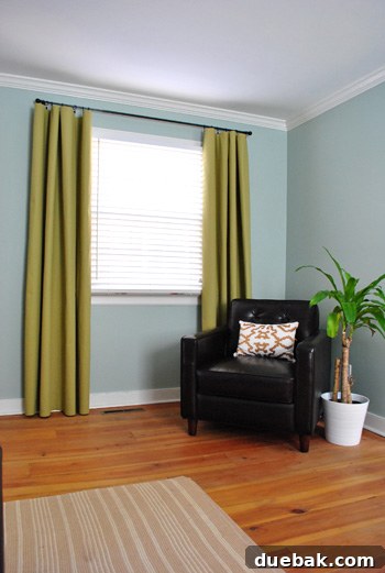 Detailed shot of curtains gently grazing the floor, showcasing elegant draping