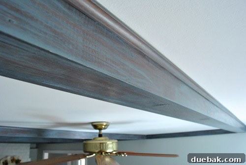 Give Your Wood Ceiling Beams A Gray Wash Makeover 12 Close-up of a gray washed beam, highlighting how paint enhances wood knots and grain