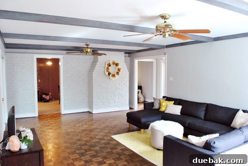 Give Your Wood Ceiling Beams A Gray Wash Makeover 3 After: Living room with gray washed wood beams, showing a rustic and warm aesthetic
