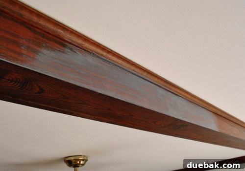 Give Your Wood Ceiling Beams A Gray Wash Makeover 4 Close-up of newly painted gray wood beams, showcasing texture and subtle color variations