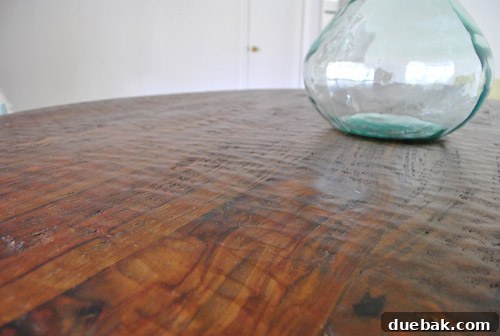 Another perspective on the Stella dining table's textured sheesham wood surface, highlighting its subtle carved details.