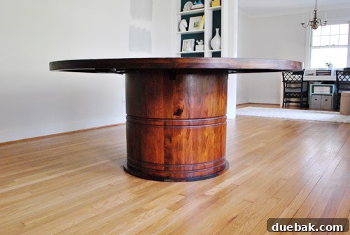 The impressive scale and design of the Stella dining table, showing its full pedestal base.