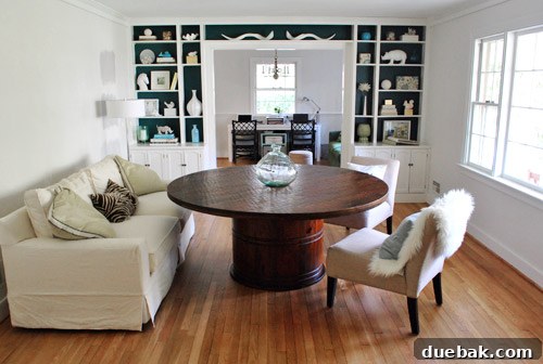 The Stella dining table currently sits alone in the dining room, awaiting the arrival of other furniture pieces.
