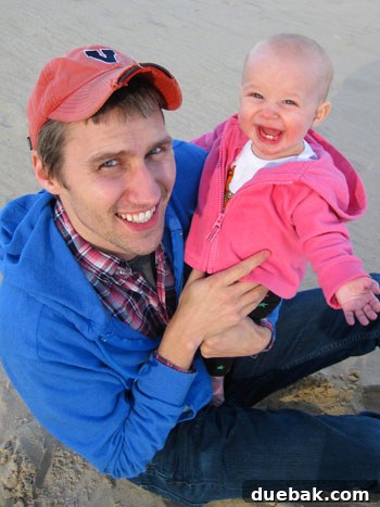 Clara and her dad at the beach