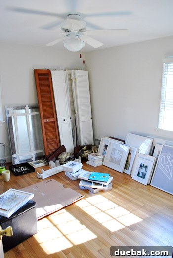 Unlock Your Glow: The Best Times to Use Tinted Primer 2 Guest bedroom before decluttering, filled with various items and frames