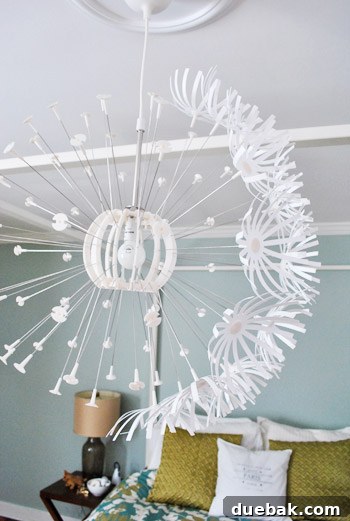 IKEA Maskros lamp with some paper 'flowers' attached, starting to take shape