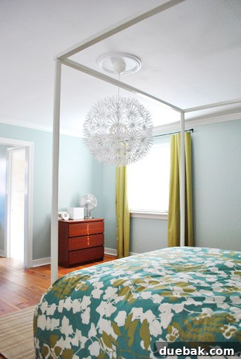 Fully assembled IKEA Maskros pendant lamp hanging in the bedroom