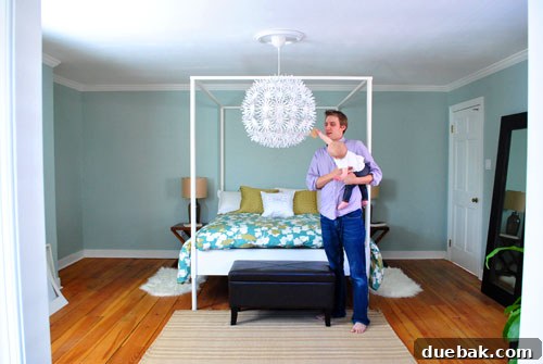 Wide shot of the bedroom with the Maskros lamp, bed, and surrounding decor