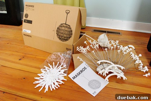 Components of the IKEA Maskros lamp laid out, awaiting assembly