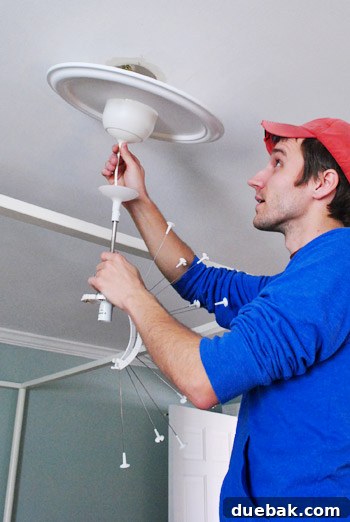 A white ceiling medallion installed on the ceiling
