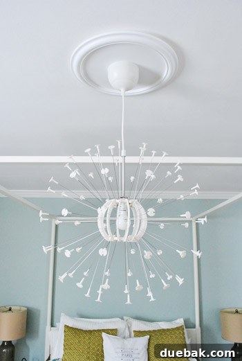 IKEA Maskros lamp base with spokes attached, hanging from the ceiling medallion