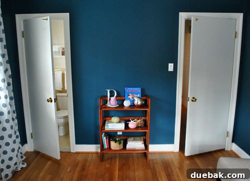 View of the guest room with seating area and window