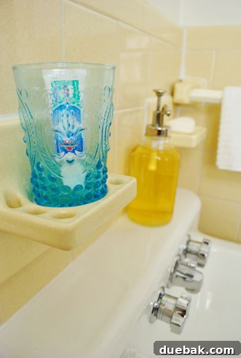 The Guest Bath: Unfussy Utility 5 Shower area showing a suction cup caddy and shower curtain.