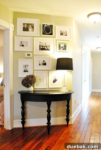Hall bathroom with floor-to-ceiling subway tile and mirror