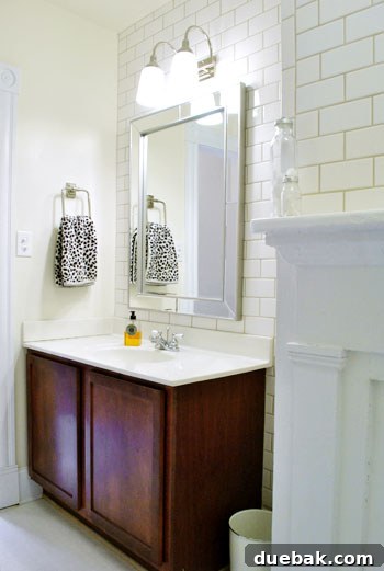 Bathroom corner with non-working fireplace mantel