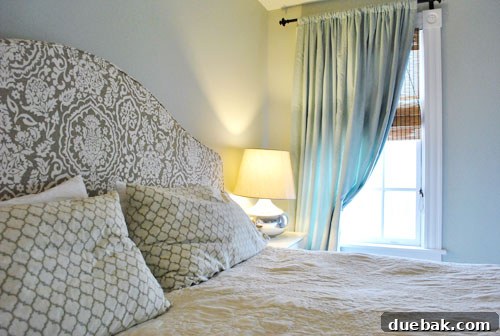 Older son's bedroom with nailhead and denim headboard and orange rug