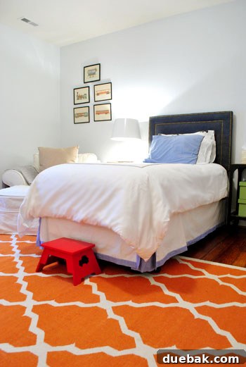 Son's bedroom with planet mobile and Greek key curtains