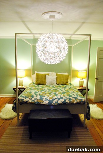 Bedroom view before the new rug, showing an empty floor area and existing bed and furniture.