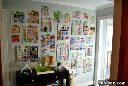 Hallway wall with newspaper templates for gallery wall layout