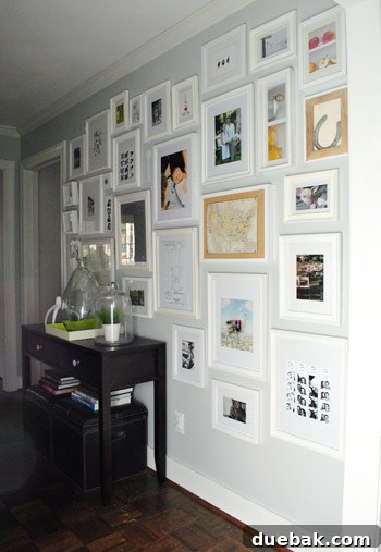 Overhead view showing the depth and arrangement of frames on the wall
