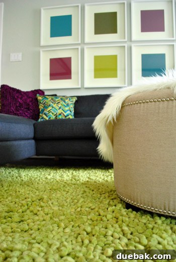 Plush Emerald Shag: Living Room's Green Oasis 6 Green shag rug with new throw pillows on a gray sectional sofa.