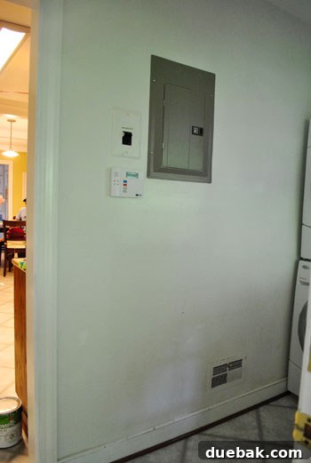 How to Permanently Repair Wall Cracks 12 Final view of the laundry room after preliminary updates, ready for further renovation