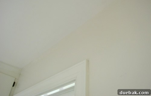 How to Permanently Repair Wall Cracks 4 Repaired laundry room ceiling after caulking and painting
