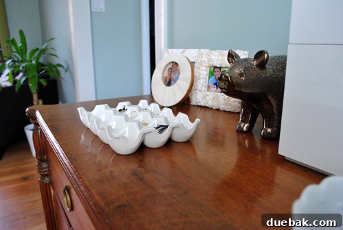 Dresser top styled with various decorative and functional items